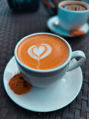 Delicious cup of coffee with latte art in middle
