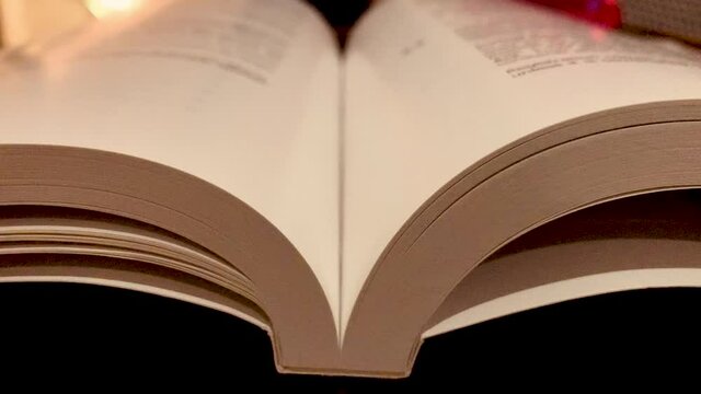 A pen falling in the middle of a book