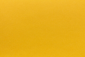 Textured surface of yellow paper