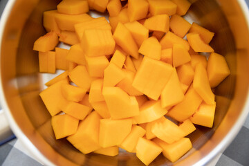 Pumpkin sliced in a bowl. Butternut squash recipe.