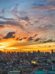 Wall murals Melon Vertical shot of the cityscape of Bangkok in Thailand at sunset