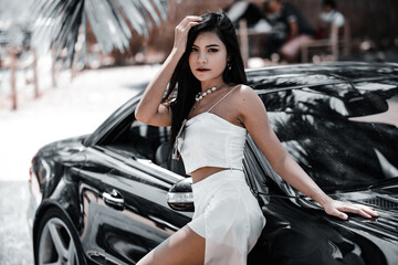 Fototapeta na wymiar Beautiful asian girl in the in luxury car.