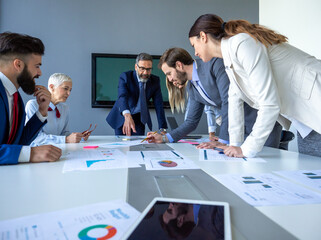 Diverse happy business people in board room meeting at the office