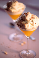 Dessert made of jelly and vanilla ice-cream in martini glasses	