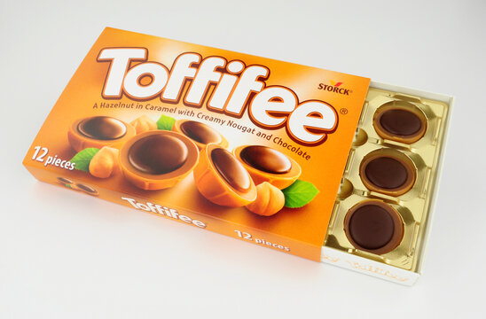 Box of Toffifee hazelnut and caramel candy cups topped with chocolate manufactured by Storck