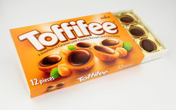 Box of Toffifee hazelnut and caramel candy cups topped with chocolate manufactured by Storck