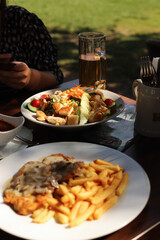 typical German food, sausages, on a wooden table in a bar
