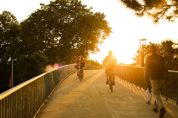 people doing sports in the golden hour
