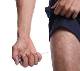 Athletic man injecting himself on white background, closeup. Doping concept