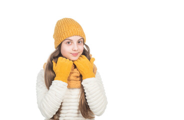 cheerful teen girl in knitted hat scarf and gloves isolated on white copy space, cold weather.