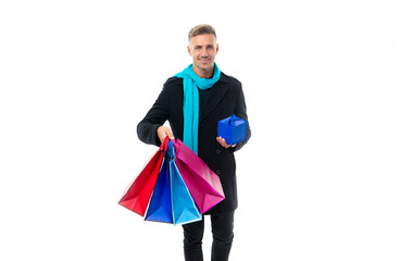 Shopping for the perfect gift. Happy man hold shopping bags and present box. Gift shop