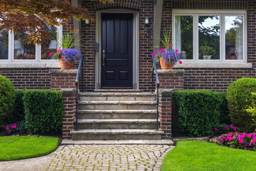 Stylish facade of an expensive residential home in summer