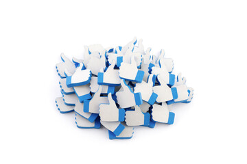 Many blue like thumb up icons on white background with clipping path. Social media concept