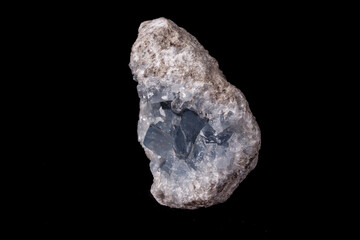 Celestine mineral stone macro on microcline on black background
