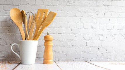 Kitchen tools and kitchenware utensil object with ingredients on kitchen shelf wood white for healthy eat and health care life.  Wall white brick background, copy space for text