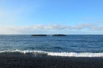 Undertow with Waves Pulling Back Off Black Sand Beach