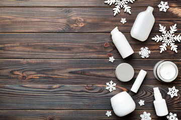 Makeup products and Christmas decorations on color background. Top view New year Beauty concept with copy space