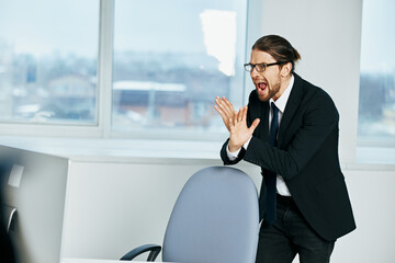 man in a suit documents in hand communication by phone technologies