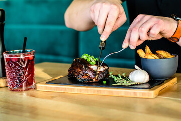 grilled spare ribs from a BBQ served with french fries