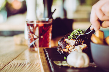 grilled spare ribs from a BBQ served with french fries