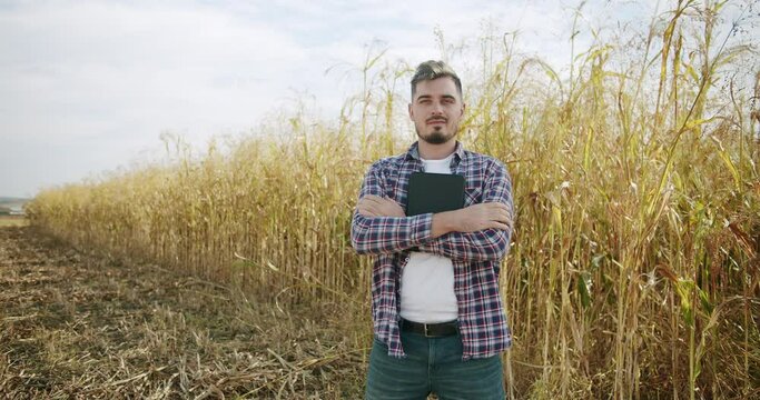 Farm Worker, Portrait Caucasian Farmer Man in Plaid Shirt in the wheat field