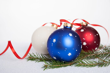 Christmas decoration - hand-painted Christmas balls in white, blue and red colors. White textured...