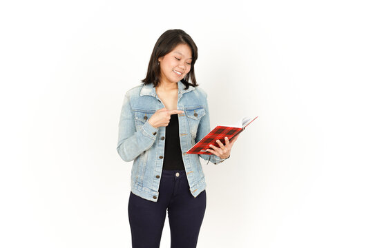 Holding book of Beautiful Asian Woman Wearing Jeans Jacket and black shirt Isolated On White Background 