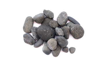 Pile of black sea pebbles isolated on the white background.