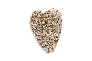 Heart shape sea pebble isolated on the white background.