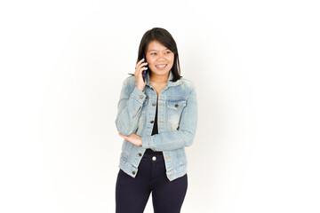 Talking on The phone of Beautiful Asian Woman Wearing Jeans Jacket and black shirt Isolated On White Background