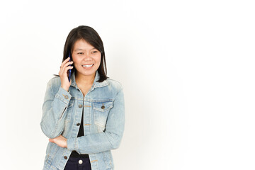 Fototapeta premium Talking on The phone of Beautiful Asian Woman Wearing Jeans Jacket and black shirt Isolated On White Background