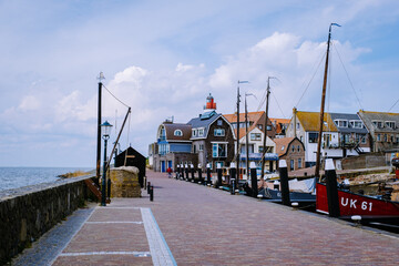 old harbor of the fishing village Urk in Flevoland Netherlands, beautiful Spring day at the former Island of Urk Holland Europe May 2021 - obrazy, fototapety, plakaty