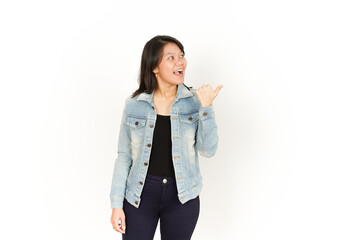 Pointing Right Side With Thumb of Beautiful Asian Woman Wearing Jeans Jacket and black shirt Isolated On White Background
