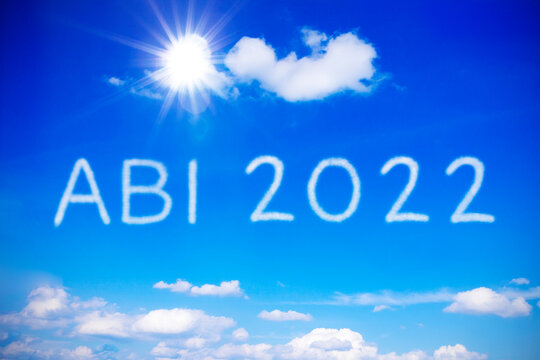 ABI 2022 written on sunny blue sky, translation: german high school graduation or A levels, concept of achievement, free at last.