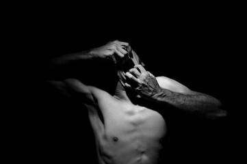 tearing his mouth open with his hands, dramatic photo