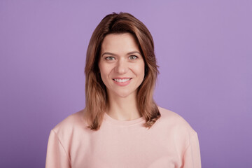 Fototapeta premium Photo of positive candid lady shiny beaming smile wear casual shirt on purple background