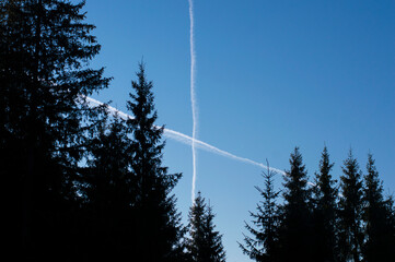 crossed airplane footprints in the sky