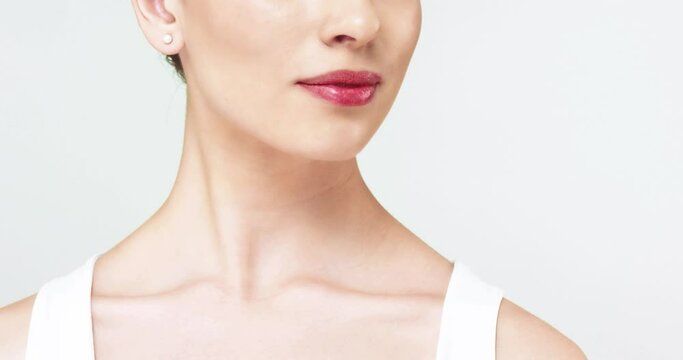 Close up of beautiful caucasian woman with perfect skin neck and collarbone looking at camera. Advertising concept of anti age cosmetics for women.