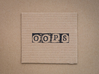 Fototapeta na wymiar Cardboard with word Oops