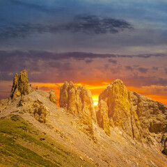 stony mountain chain at the sunset, dramatic travel background