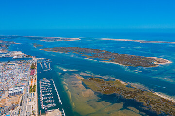 Drone shot of Faro district Lagoon in Portugal, Europe in the Ocean 