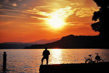 Naklejka na ściany i meble Warm sunset on Lake Garda