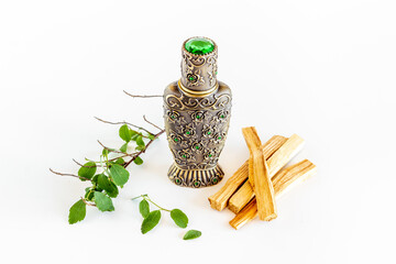 Agar wood oil fragrances or arabian oud perfume with sticks of tree