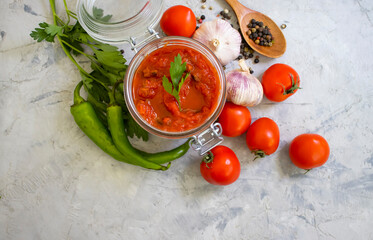 homemade tomato sauce on a concrete background
