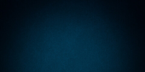 Dark blue background texture with black vignette in old vintage grunge textured border design, dark elegant teal color wall with light spotlight center