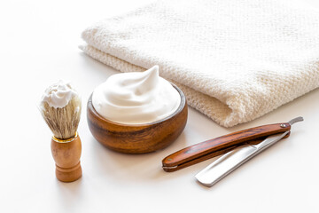 Shaving razor and foam in bowl - barber tools equipment