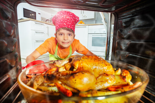 Boy Cook Take Big Chicken Meal Out From The Oven