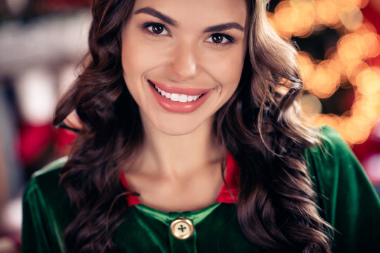 Photo of charming shiny young lady wear elf clothes celebrating christmas smiling indoors house home room