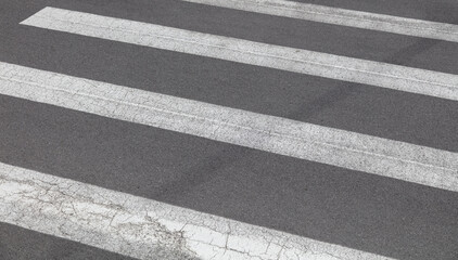 White stripes on the asphalt as a background.