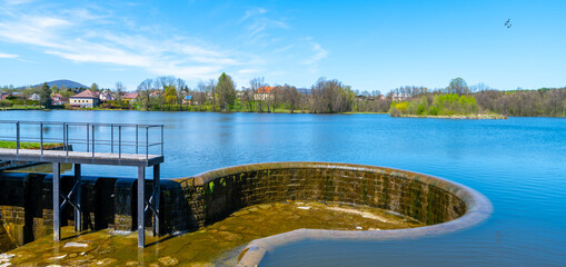 Rural pond on sunny spring day. Markvartice Pond, Jablonne v Podjestedi, Czech Republic